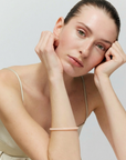 Thin Aurora Bangle peach sorbet